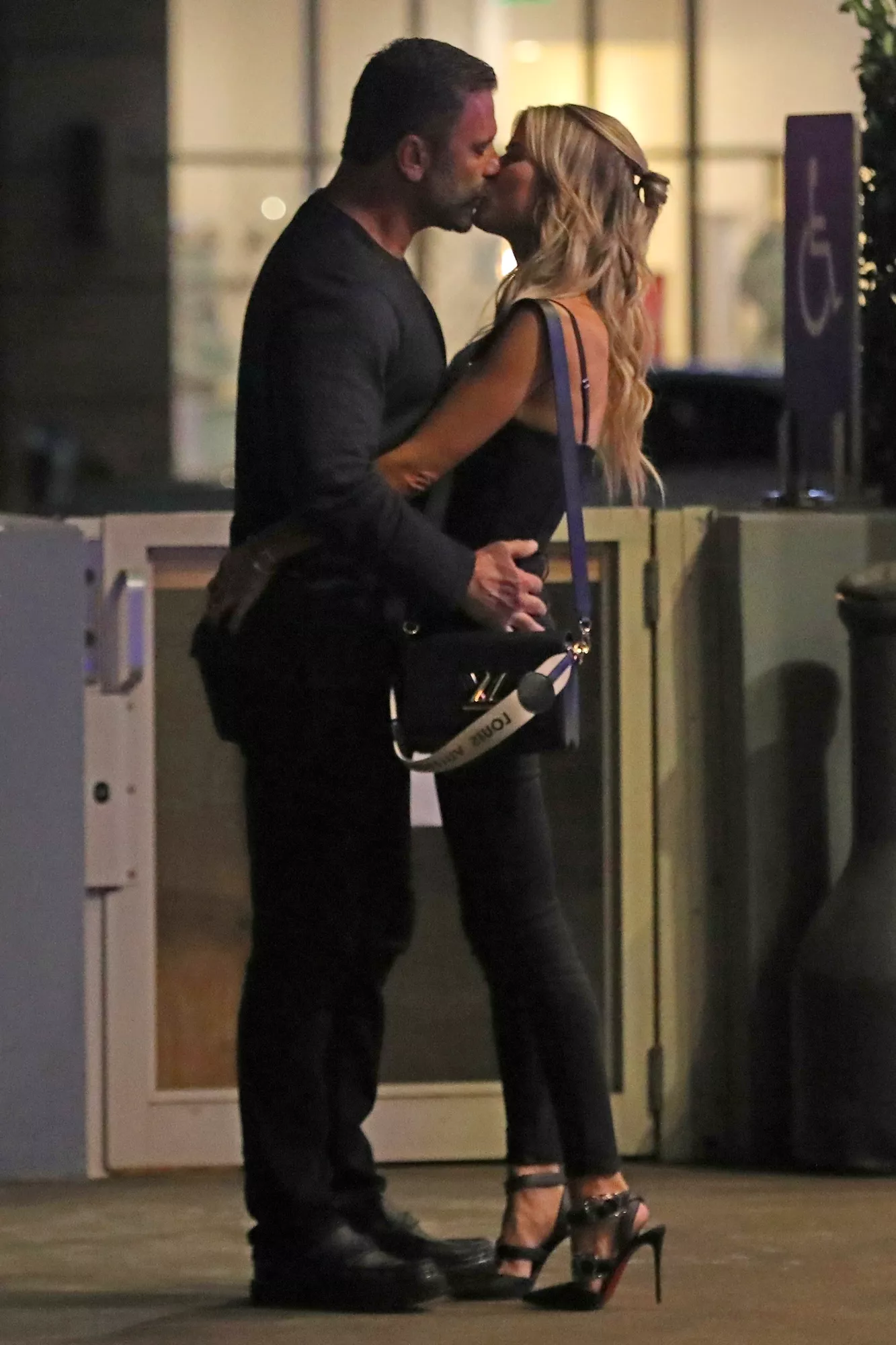 Christina Haack & her new boyfriend, Christopher Larocca pack on the PDA while out to dinner in Brentwood, CA. The new couple was dining at Baltaire restaurant in Brentwood, CA and couldn't keep their hands off each other while waiting for valet. Christopher, quite the gentleman, opened the door for Christina and they drove away in their $275,000 2025 Lamborghini Urus.